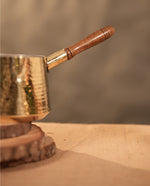 Brass saucepan tincoated with wood handle